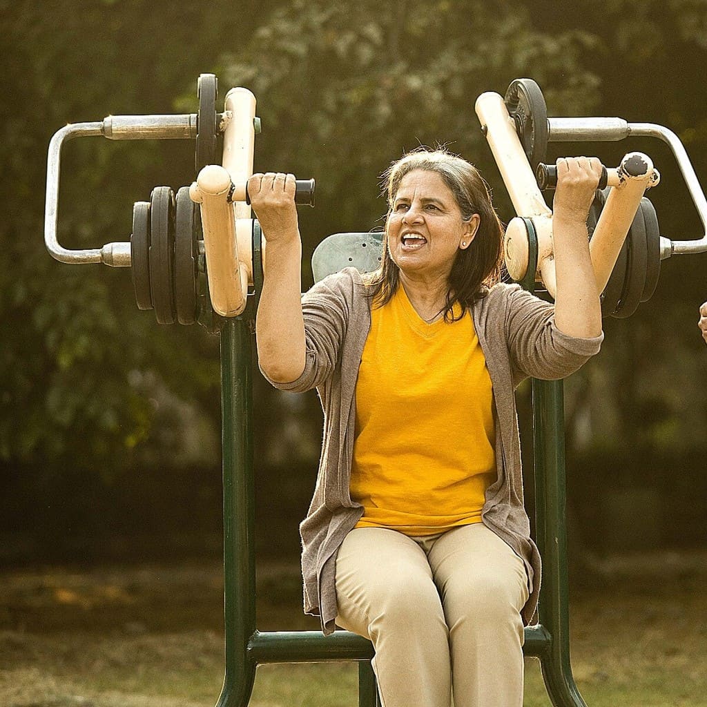 Healthy senior woman exercising with resistance band